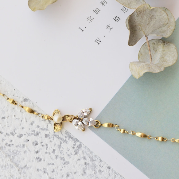 Reve 黃銅手鍊 鋯石 淡水珍珠 花 葉子 蝴蝶 翅膀 第1張的照片