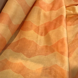ジャガード織ダブルガーゼ綿100%生地ウェブ柄オレンジ黄 1枚目の画像