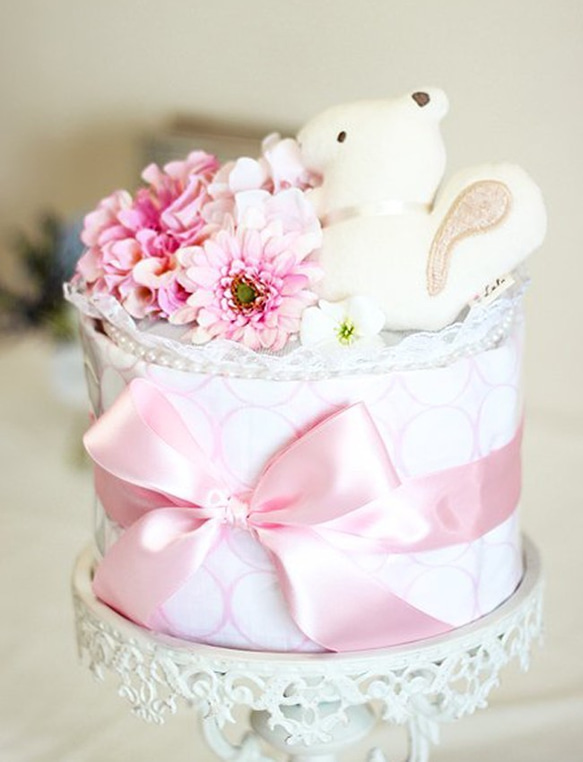 おむつケーキ・ダイパーケーキ：オーガニックおもちゃ付き　おくるみブランケットケーキ・サークルピンク 1枚目の画像