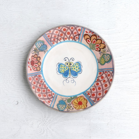 花と蝶絵のリム皿(ピンク釉） 1枚目の画像