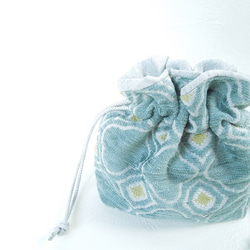 モロッカン・サックスブルーのコロンとした巾着ポーチ:受注製作です　 1枚目の画像