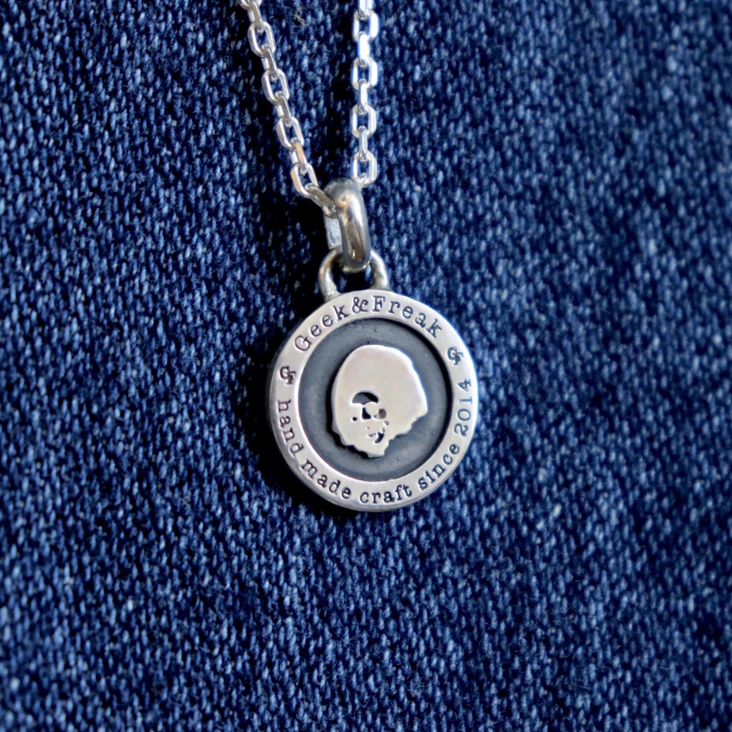 afro logo coin necklace