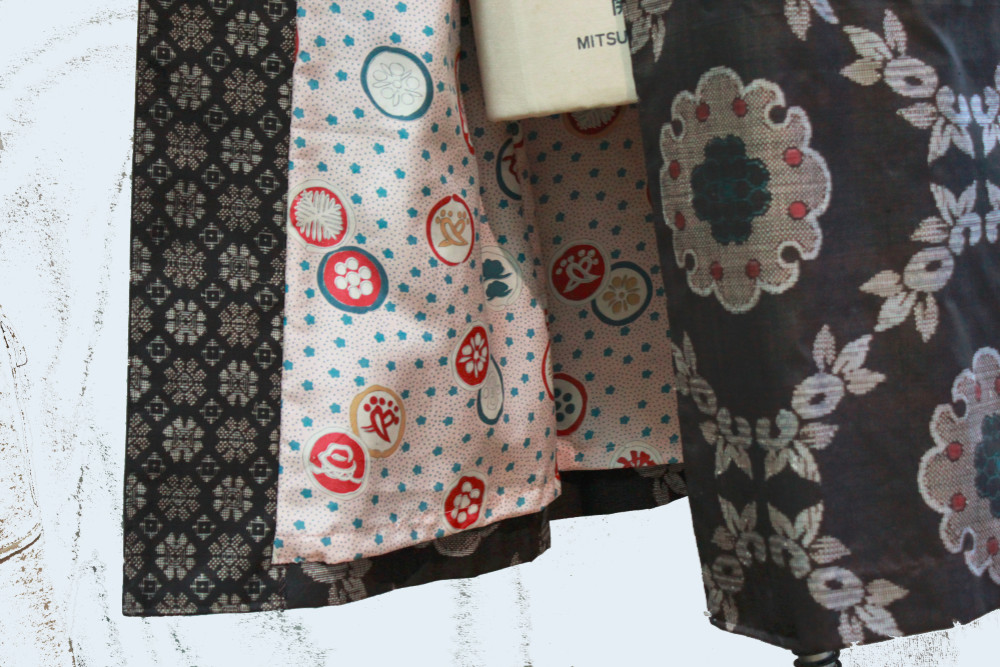 泥大島スタンド衿のコート