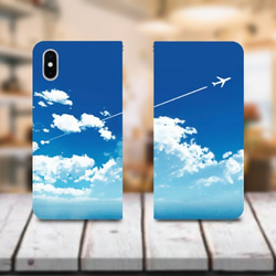 青空と飛行機雲 ver1 手帳型 スマホケース iPhone12・iPhoneSE3にも対応！ 1枚目の画像