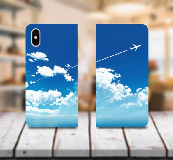 青空と飛行機雲 ver1 手帳型 スマホケース iPhone12・iPhoneSE3にも対応！ 1枚目の画像