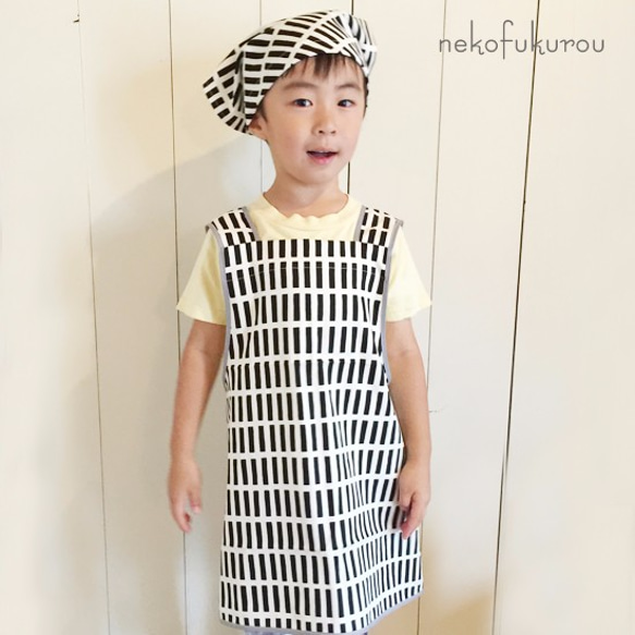 兒童圍裙（120  -  130大小）三角形白色×黑色 第1張的照片