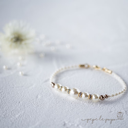 施華洛世奇珍珠和波光粼粼的Rondel絲綢編織的Macrame手鍊（生成） 第1張的照片