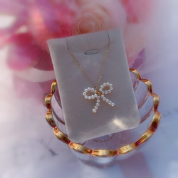 純手工編織可愛蝴蝶結天然淡水珍珠項鍊 第2張的照片