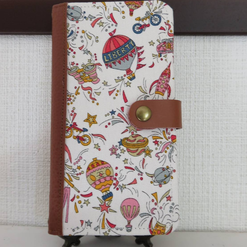 リバティ“スカイハイ(ポケットいっぱいの思い出)” 手帳型スマホケース 