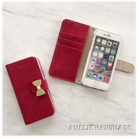 ★【iPhone】スエード調RED　オリジナルリボンビジュー手帳型スマホケース 1枚目の画像