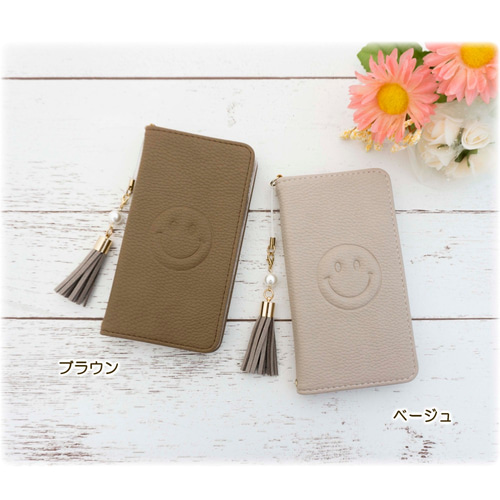 スマホケース手帳型　ニコちゃん多機種対応スワロフスキー 楽天市場】手帳型 スマホケース ニコちゃん スマイル キラキラ