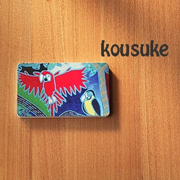 [kousuke]モバイルバッテリー　真っ赤なインコ 1枚目の画像