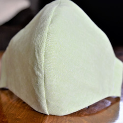 鼻ワイヤー入り立体ミルキーグリーンのハーフリネンマスク（内側には肌に優しい綿100％ スムースニット 生地 ） 1枚目の画像