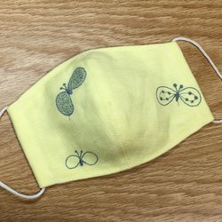 ミナペルホネン 立体マスク choucho yellow ポケット付き 1枚目の画像