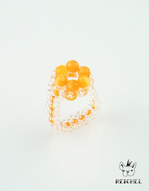 橙花環和一組手鐲 第5張的照片