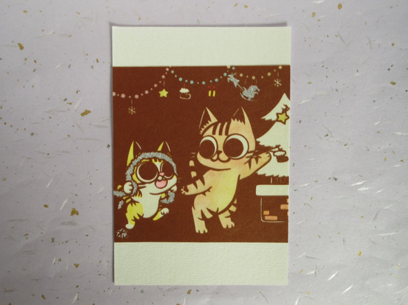 切り絵ポストカード　クリスマスツリーの飾りつけ 1枚目の画像