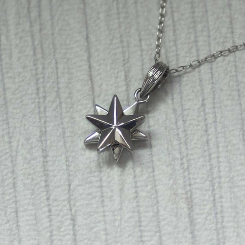 回転するプラチナ星のペンダント【送料無料】くるくる回りながら流れ落ちるプラチナスターをイメージした首飾りです
