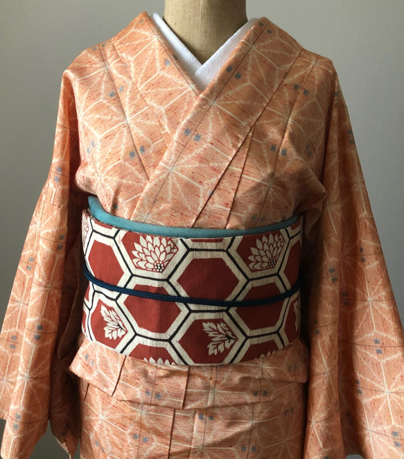 正絹　手縫い単衣紬　コーラルオレンジに麻の葉模様 2枚目の画像