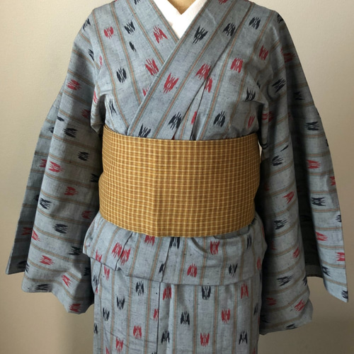 AAお仕立て上がり正絹紬 グリーン地に幾何学模様 けばけばしく