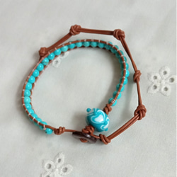 花のとんぼ玉(水中花入り)のストラップまたはイヤホンジャック（ピンク