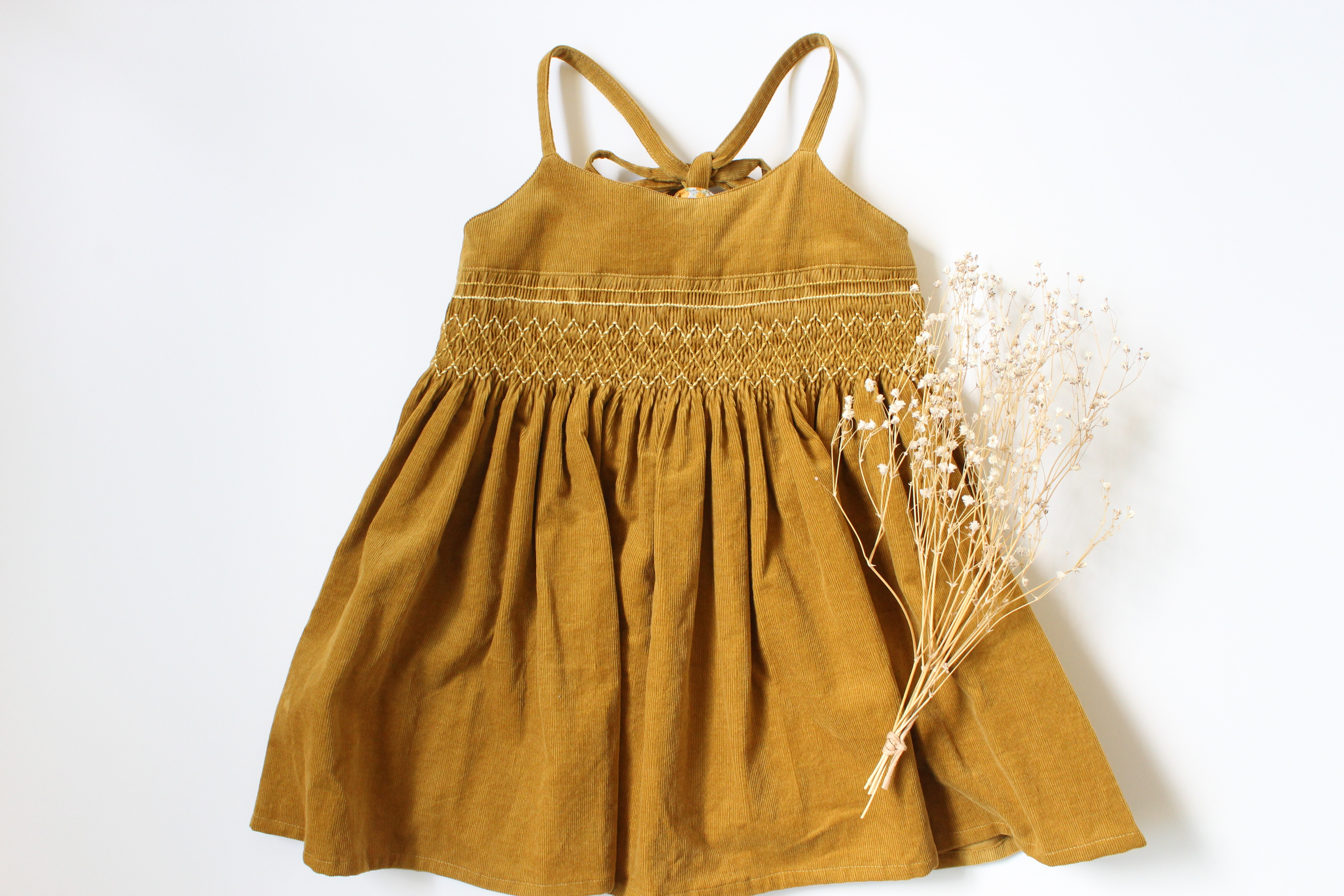 【100サイズ】スモッキング刺繡のキャミソールワンピース　マスタード