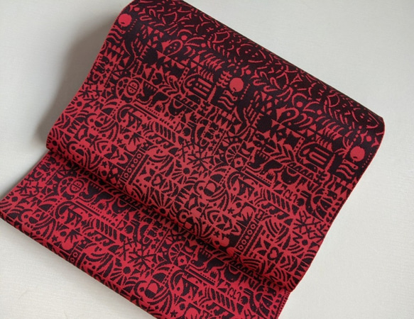 手織り博多織　帯「玉手箱2」赤と黒の個性的な柄のおしゃれ帯 1枚目の画像
