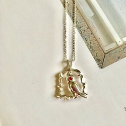 ほっぺがオレンジサファイア　オカメインコのネックレス 1枚目の画像