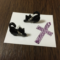 紫に染まる十字架のカード 1枚目の画像