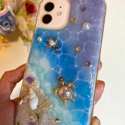 iPhoneクリアケース 海からのプレゼントスマホカバー 幸運を呼ぶオルゴナイトiPhone14シリーズ全対応 光る砂浜 3枚目の画像