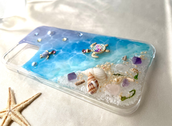 iPhoneクリアケース 海からのプレゼントスマホカバー 幸運を呼ぶオルゴナイトiPhone14シリーズ全対応 光る砂浜 8枚目の画像