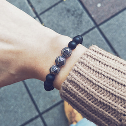 Elastic beaded bracelet with steel spheres squared bronze 2枚目の画像