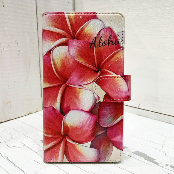 プルメリアの手帳型iphoneケース　ハワイアン柄ブックタイプケース　かわいい赤いお花　カード収納 1枚目の画像