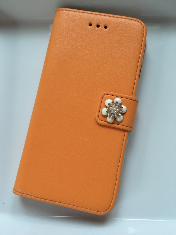 今月のサービス品iPhone6手帳型ケース❤️小花（オレンジ） 1枚目の画像