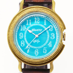 GENSO コバルトターコイズの腕時計 アラビア数字文字盤 青い文字盤に白い針 1枚目の画像