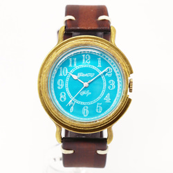 GENSO コバルトターコイズの腕時計 アラビア数字文字盤 青い文字盤に白い針 2枚目の画像