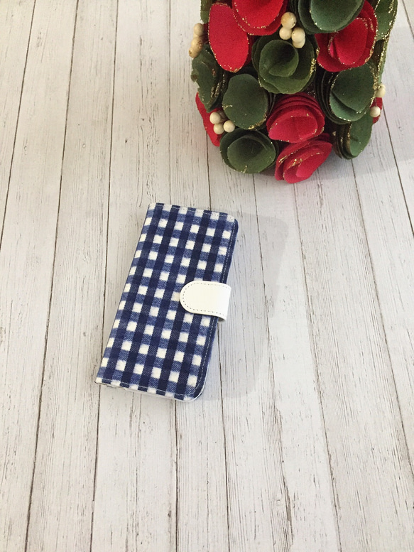 筆記本類型拉絲方格布紋藍色iPhone護套 第1張的照片