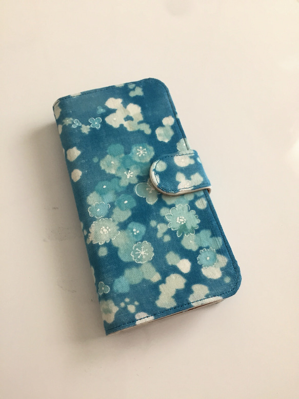 筆記本型小花浮海iPhone手機殼 第1張的照片