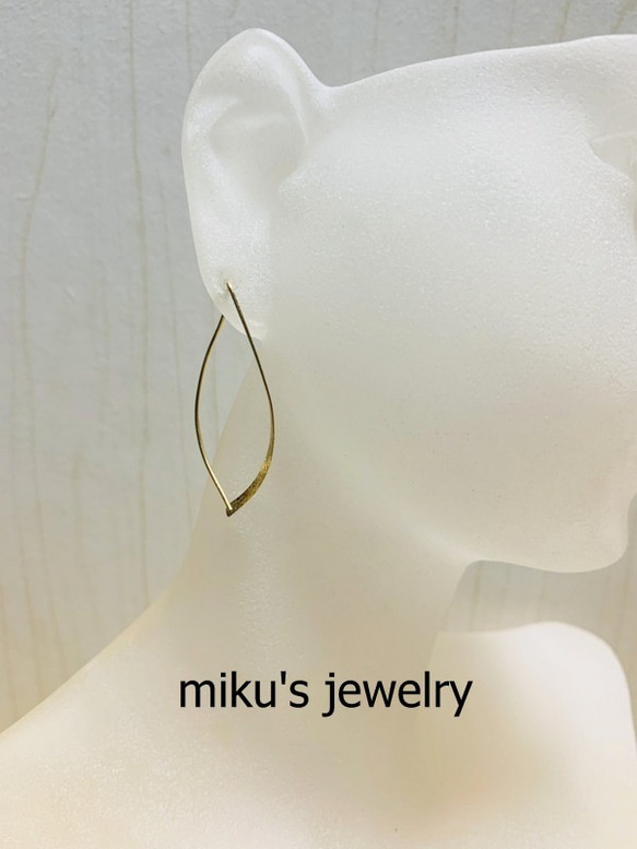 14kgf curved hoop earrings 1枚目の画像