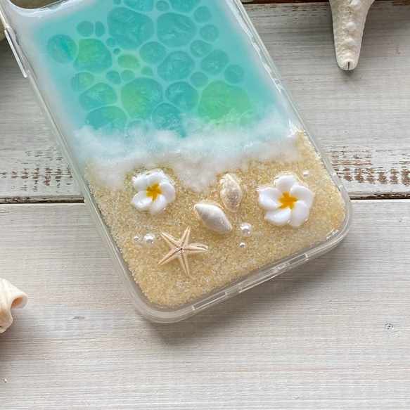 水綠色海洋和雞蛋花混合保護殼，適合各種 iPhone 尺寸 第5張的照片