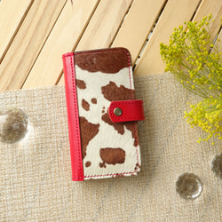 毛付き革ハラコ「ホルスタイン」 手帳型スマホケース iPhone,Xperia 1枚目の画像