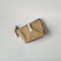 poitto16 マチ5深型 typewriter POUCH ベージュ 1枚目の画像